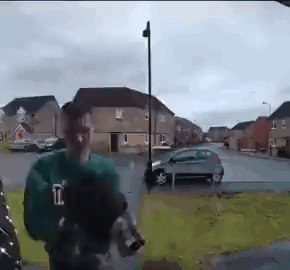 Man In Green Shirt With Letter L GIF