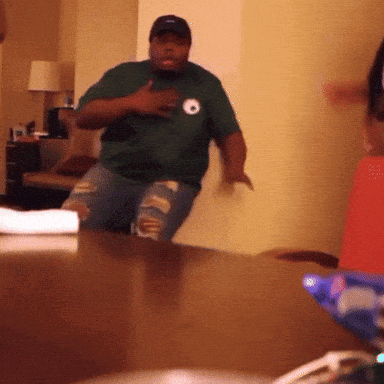 Man in Green Shirt With Letter O Dancing