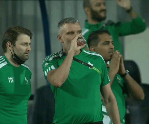 Man in Green Shirt With MV