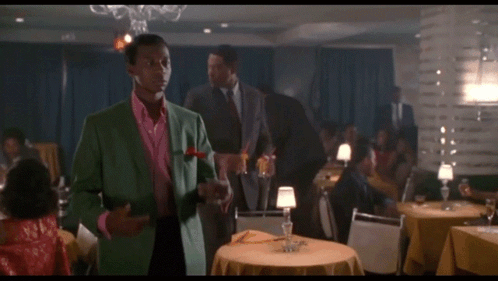 Man In Green Suit Next To Other Man Saying My Love GIF