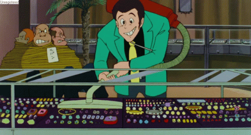 Man In Green Suit Vacuuming Display GIF