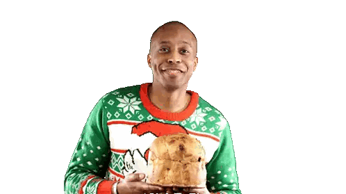 Man in Green Sweater Holding Cake
