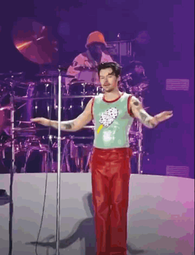 Man In Green Tank Top Red Pants Microphone GIF