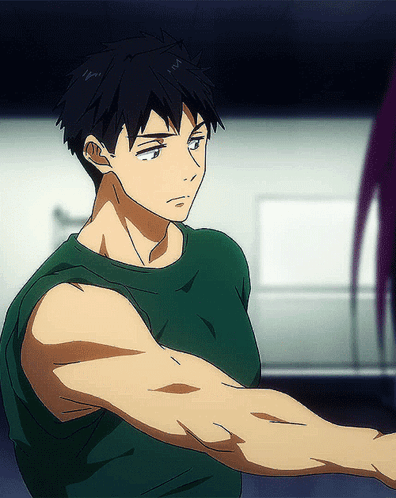 Man In Green Tank Top With Muscular Arm GIF