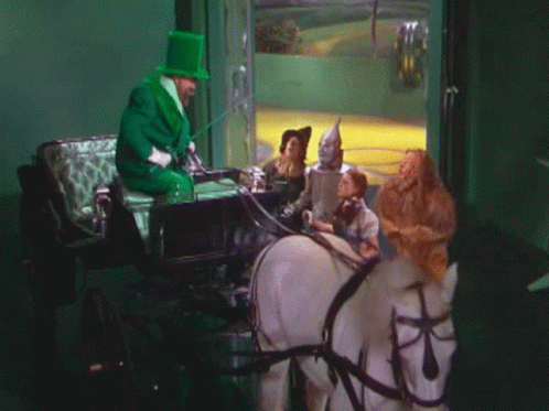 Man in Green Top Hat Pulling Carriage