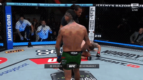 Man in Green Venom Shorts Boxing Another Man