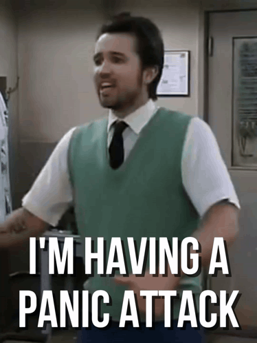 Man in Green Vest and Tie Saying Panic Attack