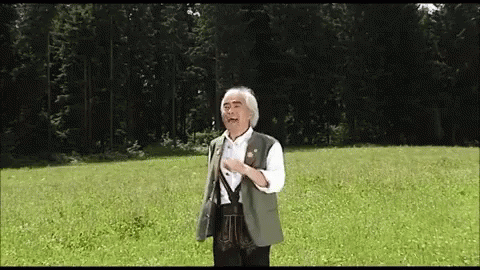Man in Green Vest in Field