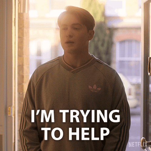 Man in Grey Adidas Sweater Saying I'm Trying to Help