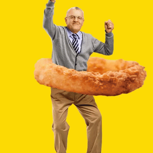 Man in Grey Cardigan and Tie Holding Fried Onion Ring