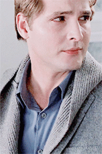 Man in Grey Jacket and Blue Shirt Close Up