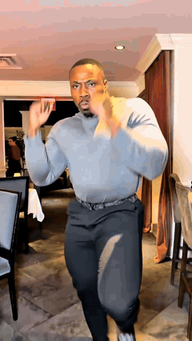 Man In Grey Shirt And Black Pants Dancing GIF