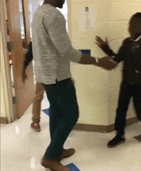 Man In Grey Shirt Dancing With Boy In Black GIF