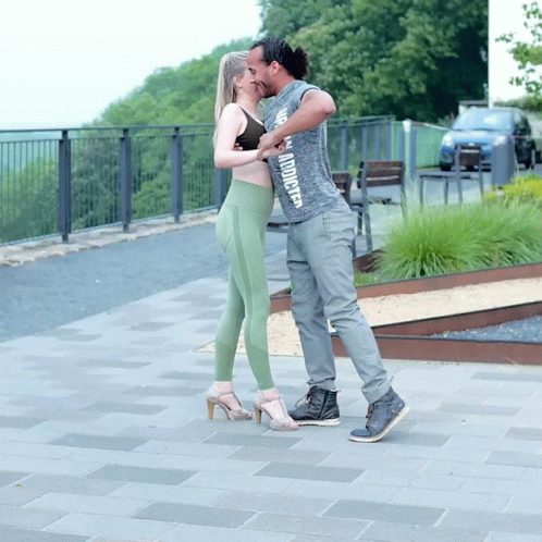Man in Grey Shirt 'I Am Addicted' Kissing Woman