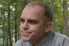 Man In Grey Shirt Smiling Eyes Closed In Woods GIF