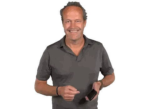 Man in Grey Shirt Talking on Cellphone