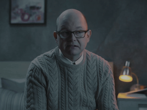 Man in Grey Sweater and Glasses Says It's Good to Be the King