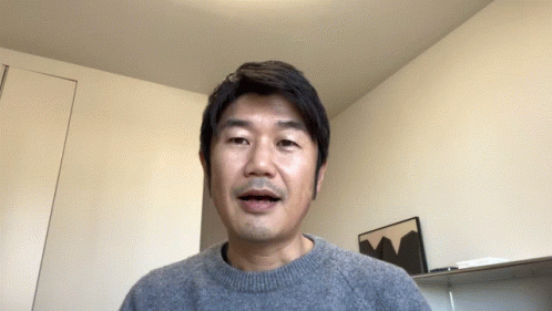 Man in Grey Sweater