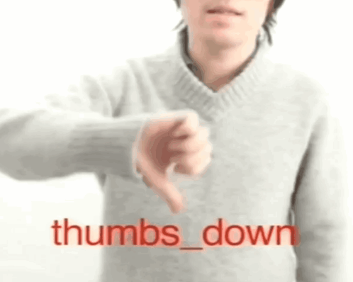 Man in Grey Sweater Giving Thumbs Down