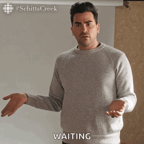 Man in Grey Sweater Waiting