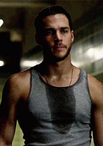 Man in Grey Tank Top Sweating