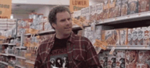 Man in Grocery Aisle Looking at Cereal Boxes