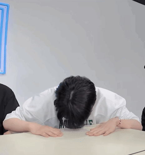Man In GS Sweatshirt Covering Face GIF