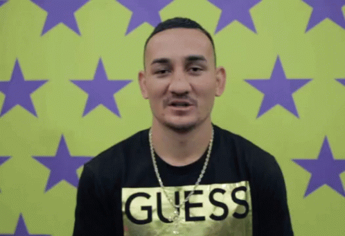 Man in Guess Shirt With Green Purple Background