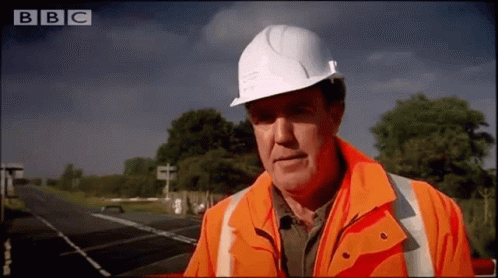Man in Hard Hat and Orange Jacket on BBC Channel
