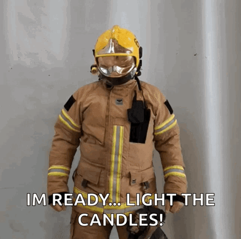 Man In Hard Hat And Suspenders Holding Stick In Front Of Yellow Blippi Building GIF