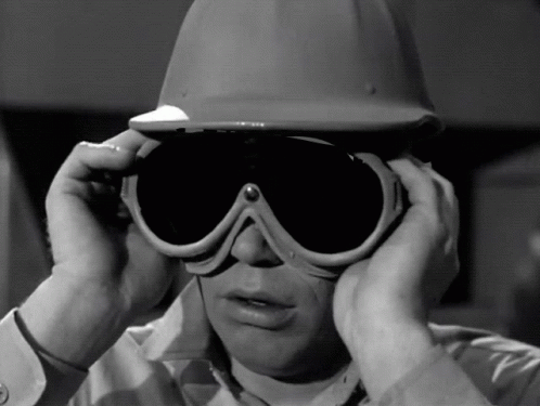 Man in Hard Hat Covering Ears