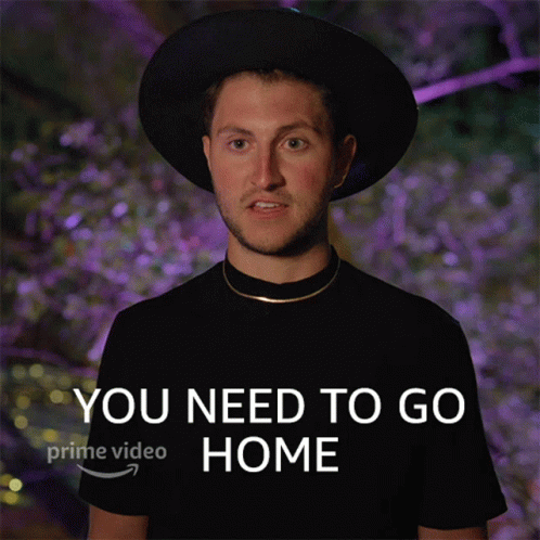 Man in Hat and Black Shirt Saying You Need to Go Home