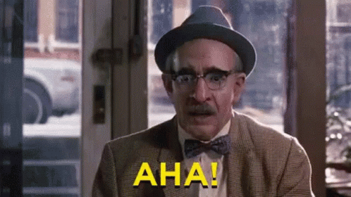 Man in Hat and Bow Tie Says Aha