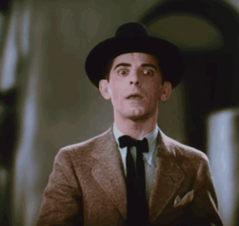 Man in Hat and Bow Tie Surprised