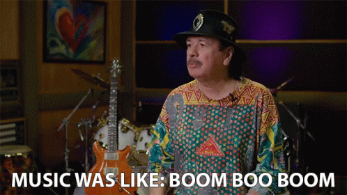 Man In Hat And Colorful Shirt Says Music Was Like Boom Boo Boom GIF