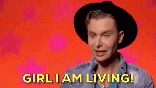 Man in Hat and Denim Jacket Saying Girl I Am Living
