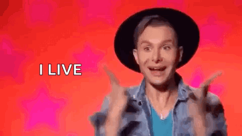 Man in Hat and Denim Jacket Saying I Live