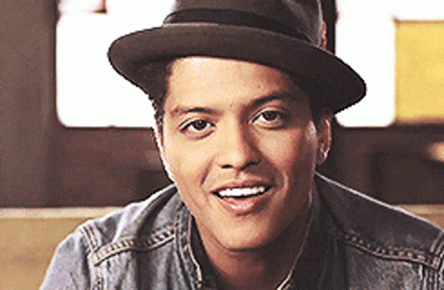 Man in Hat and Denim Jacket Smiling