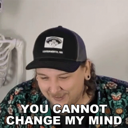 Man in Hat and Floral Shirt Laughing You Cannot Change My Mind