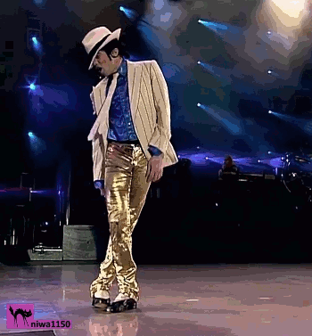 Man in Hat and Gold Pants Dancing on Stage