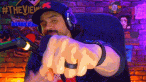 Man In Hat And Headphones At Microphone GIF