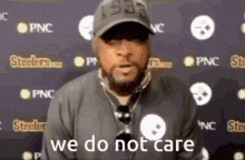 Man in Hat and Necklace Says We Do Not Care