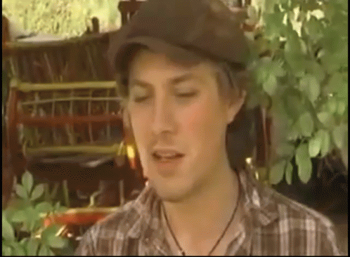 Man in Hat and Plaid Shirt Eyes Closed