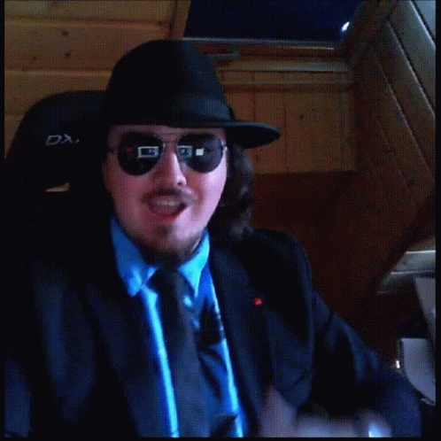Man in Hat and Sunglasses Thumbs Up