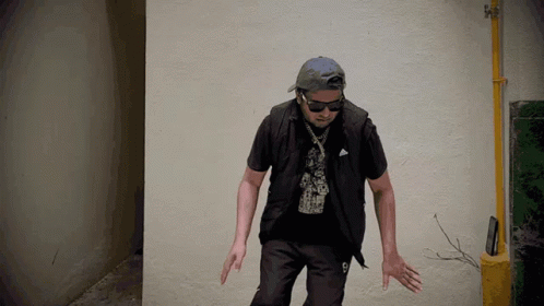 Man In Hat And Sunglasses With Number 9 On Shirt GIF