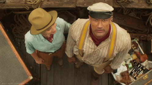 Man in Hat and Suspenders and Woman in Blue Shirt