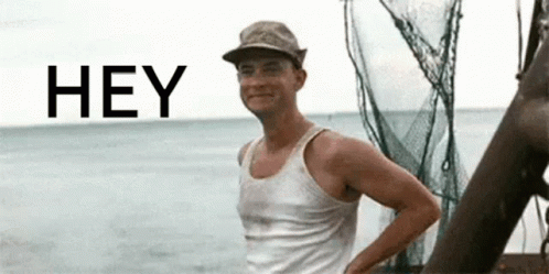 Man in Hat and Tank Top Saying Hey