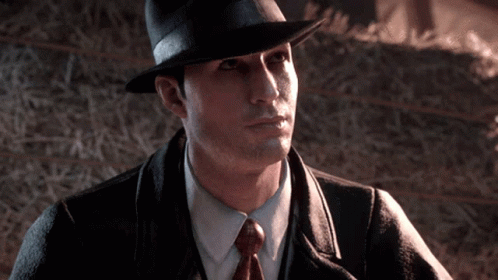 Man in Hat and Tie by Hay Bale