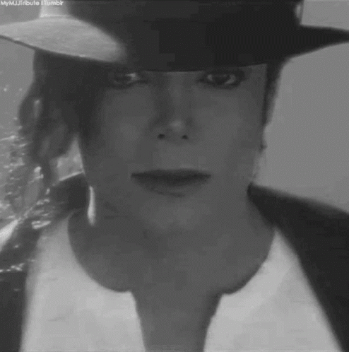 Man in Hat and White Shirt
