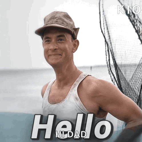 Man in Hat and White Tank Top Saying Hello